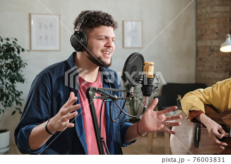 Male singer recording a song 76003831