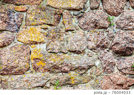 Rough stone wall as creative background texture 76004033