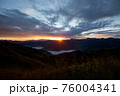 Early morning in the mountains. The sun rises over the mountains. Dawn in the mountains. 76004341