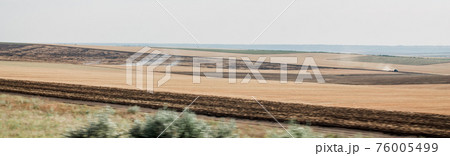 Rural landscape field in rustic style on yellow background. Natural scenery panorama. Countryside sunny morning environment. Summer nature view. Local travel in country 76005499