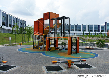 SEREMBAN, MALAYSIA -JULY 1, 2020: Selected focused on modern children outdoor playground in the public park. It was designed with a few different themes for kids to enjoy. Kids happy. SEREMBAN, MALAYSIA -JULY 1, 2020: Selected focused on modern children outdoor playground in the public park. It was designed with a few different themes for kids to enjoy. Kids happy. 76009266