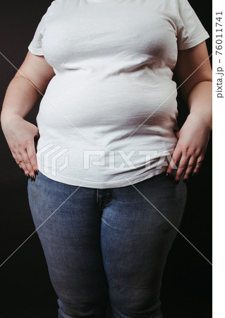 Fat people. Overweight woman at studio background 76011741