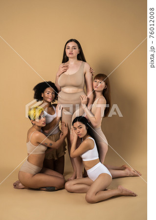Five diverse woman with different skin and body types posing with confidence Five diverse woman with different skin and body types posing with confidence 76012008