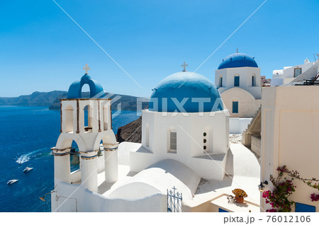 White and blue Santorini - view of caldera with domes 76012106