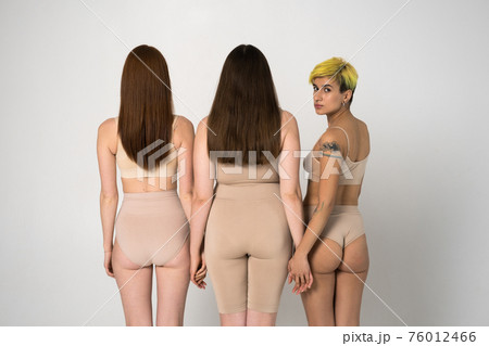 Back view of the three different girls posing at the studio Back view of the three different girls posing at the studio 76012466