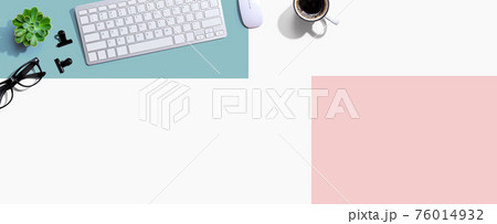 Computer keyboard with a cup of coffee and eyeglasses Computer keyboard with a cup of coffee and eyeglasses 76014932