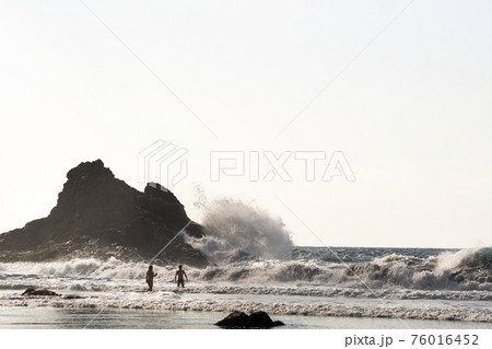 People on the sandy beach of Benijo on the island of Tenerife.Spain People on the sandy beach of Benijo on the island of Tenerife.Spain 76016452