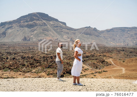 A couple in love stands in the crater of the Teide volcano.Tenerife, Canary Islands 76016477