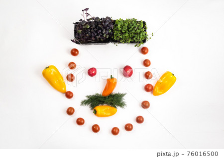 The face of a man made of sliced vegetables on a white background 76016500