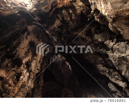 Sun beam in cave Sun beam in cave 76016891