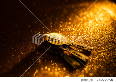 Keys on gold background Keys on gold background 76022750
