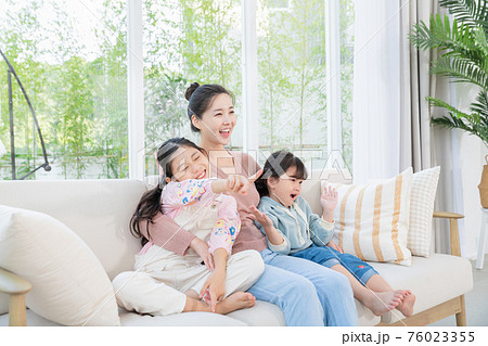 Portrait of happy cheerful family, young mother and two daughters 097 76023355