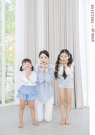 Portrait of happy cheerful family, young mother and two daughters 350 Portrait of happy cheerful family, young mother and two daughters 350 76023549