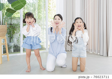 Portrait of happy cheerful family, young mother and two daughters 331 Portrait of happy cheerful family, young mother and two daughters 331 76023711