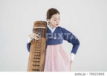 Male and female in Korean traditional clothes Hanbok. comic humorous concept. 090 76023968