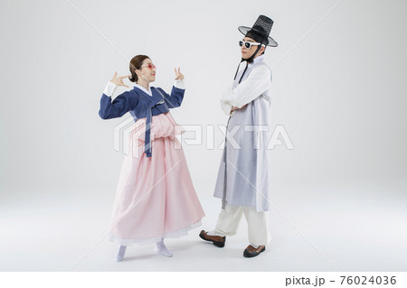 Male and female in Korean traditional clothes Hanbok. comic humorous concept. 009 76024036