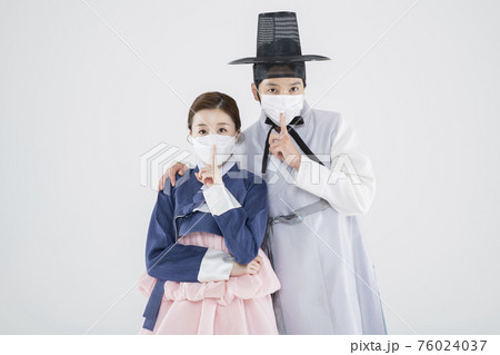 Male and female in Korean traditional clothes Hanbok. comic humorous concept. 140 76024037