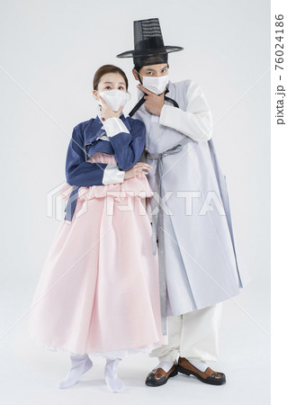 Male and female in Korean traditional clothes Hanbok. comic humorous concept. 139 76024186