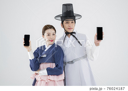 Male and female in Korean traditional clothes Hanbok. comic humorous concept. 128 76024187