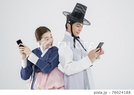 Male and female in Korean traditional clothes Hanbok. comic humorous concept. 125 76024188