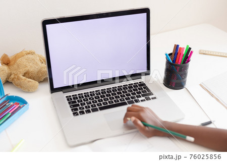 Hand of african american girl in bedroom using laptop with copy space for online school lesson 76025856