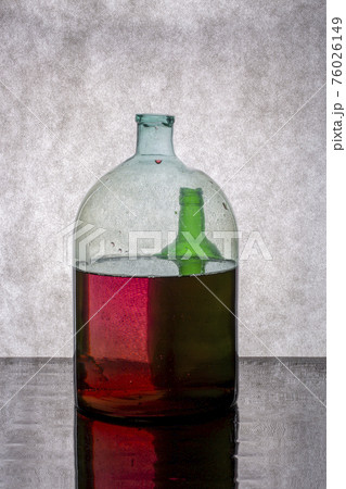 Still life with glassware on a reflective surface Still life with glassware on a reflective surface 76026149