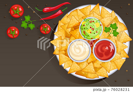 Dish with nacho chips and sauces in bowls 76028231