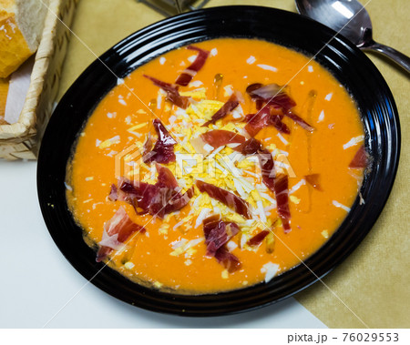 Salmorejo with jamon and boiled egg Salmorejo with jamon and boiled egg 76029553