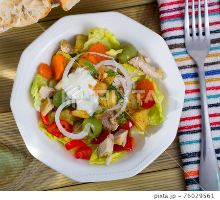 Top view of warm salad with chicken and eggplant 76029561