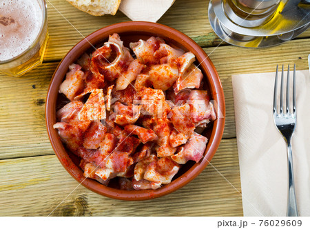 Orejas de cerdo - spanish dish. Roast pigs ears with spice 76029609