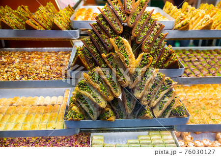 Honey baklava with nuts on display of Turkish sweetshop 76030127