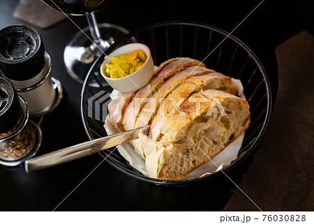 Slices of home baked white bread and fresh butter 76030828