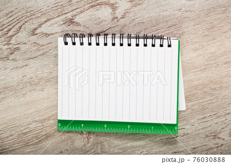 Notebook in line on table 76030888