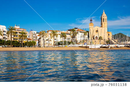 View from sea of Sitges beach and Church, Catalonia, Spain 76031138