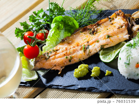 Roasted trout fillet with rice Roasted trout fillet with rice 76031539