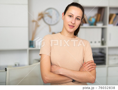 Portrait of smiling girl standing in office 76032838