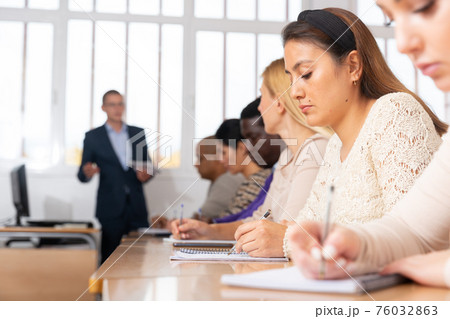 Young woman working during group business training Young woman working during group business training 76032863