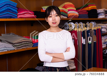 Salesgirl of clothing store Salesgirl of clothing store 76034888