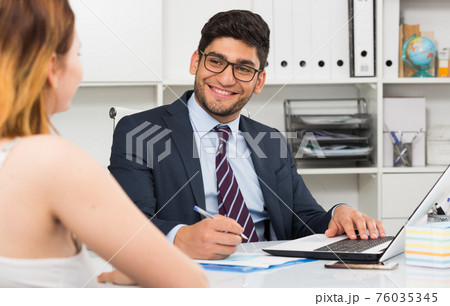 Colleagues meeting in office Colleagues meeting in office 76035345