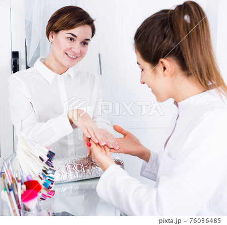 Woman doing manicure 76036485