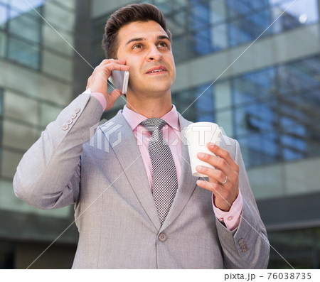 Businessman having phone call conversation Businessman having phone call conversation 76038735