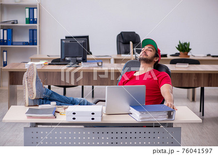 Young male pizza guy in industrial espionage concept Young male pizza guy in industrial espionage concept 76041597