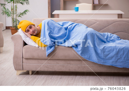 Young man suffering at home Young man suffering at home 76043826