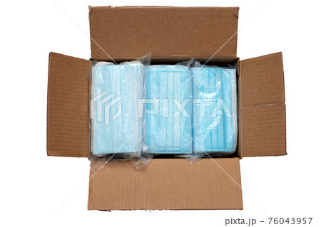 Disposable face masks in a package . Medical mask in the box ready to shipment isolated on white background Disposable face masks in a package . Medical mask in the box ready to shipment isolated on white background 76043957