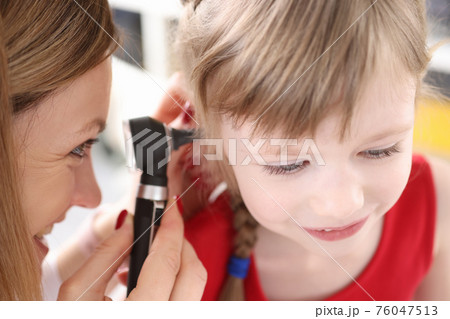 Doctor conducts medical examination of ear of little girl Doctor conducts medical examination of ear of little girl 76047513
