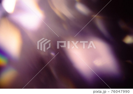 colorful warm rainbow light leaks on black background with dust texture 76047990