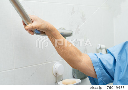 Asian senior or elderly old lady woman patient use toilet bathroom handle security in nursing hospital ward, healthy strong medical concept. Asian senior or elderly old lady woman patient use toilet bathroom handle security in nursing hospital ward, healthy strong medical concept. 76049483