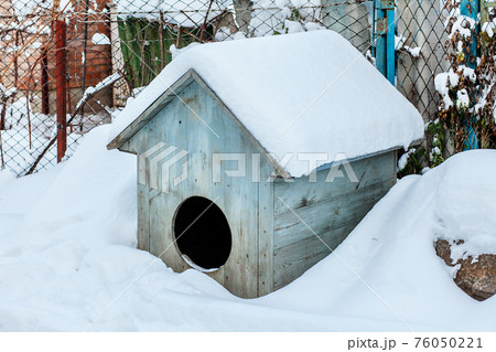 Snow-covered old yard in the village on a sunny winter day Snow-covered old yard in the village on a sunny winter day 76050221