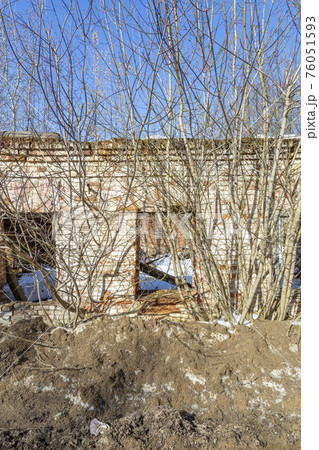 Part of the old facade of an abandoned stone house Part of the old facade of an abandoned stone house 76051593