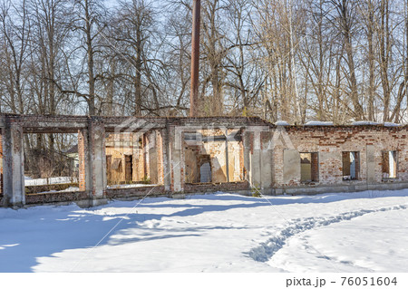 Part of the old facade of an abandoned stone house Part of the old facade of an abandoned stone house 76051604